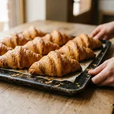 A tray of golden butter croissants
